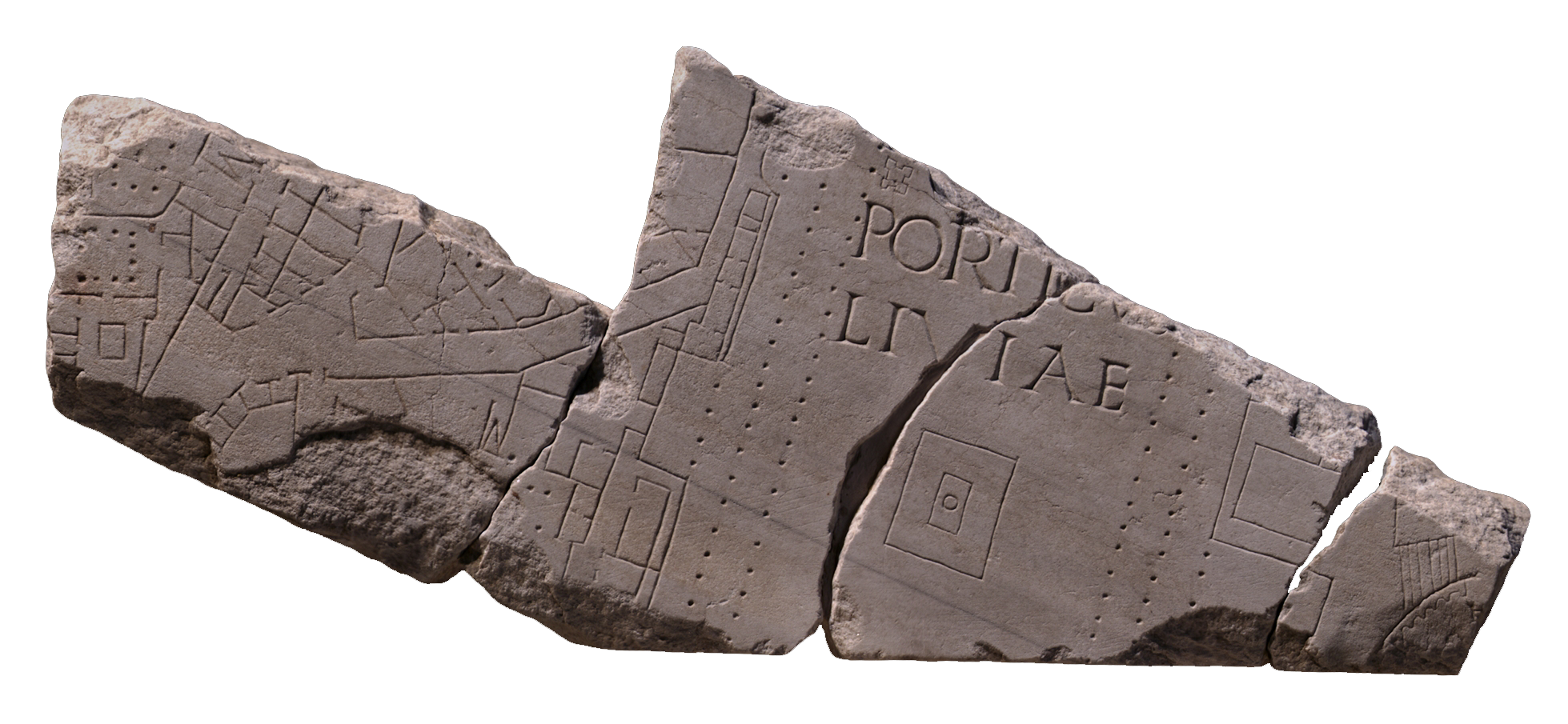 A broken stone fragment with markings on in little squares, lines, and dots.