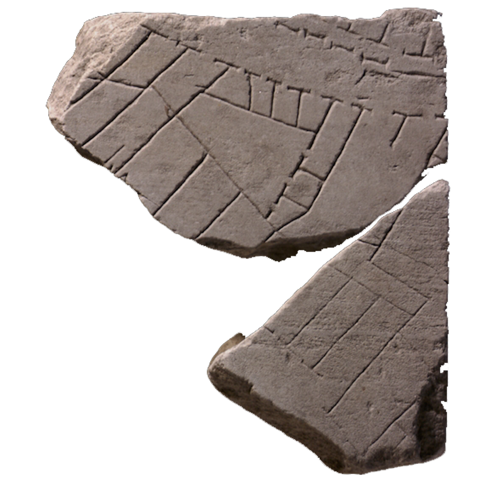 A broken stone fragment with markings on in little squares, lines, and dots.
